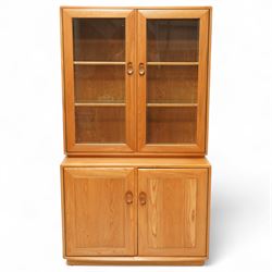 Ercol Windsor light elm dresser/display cabinet, glazed floating top section having two fr...