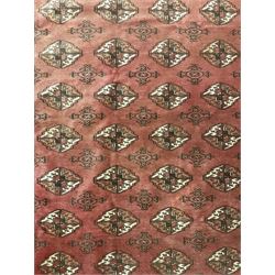 Afghan Bokhara red ground rug, the field decorated with five rows of Gul motifs, guarded border decorated with lozenges and geometric pattern 