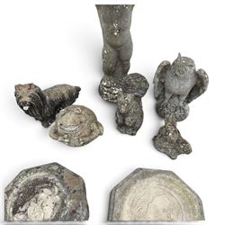 Assorted cast stone garden ornaments, comprising putto bird bath (W43cm H72cm), owl, dog, frog, rabbit and two squirrel figures, with two octagonal relief-moulded stepping stones, one decorated with central cat motif
