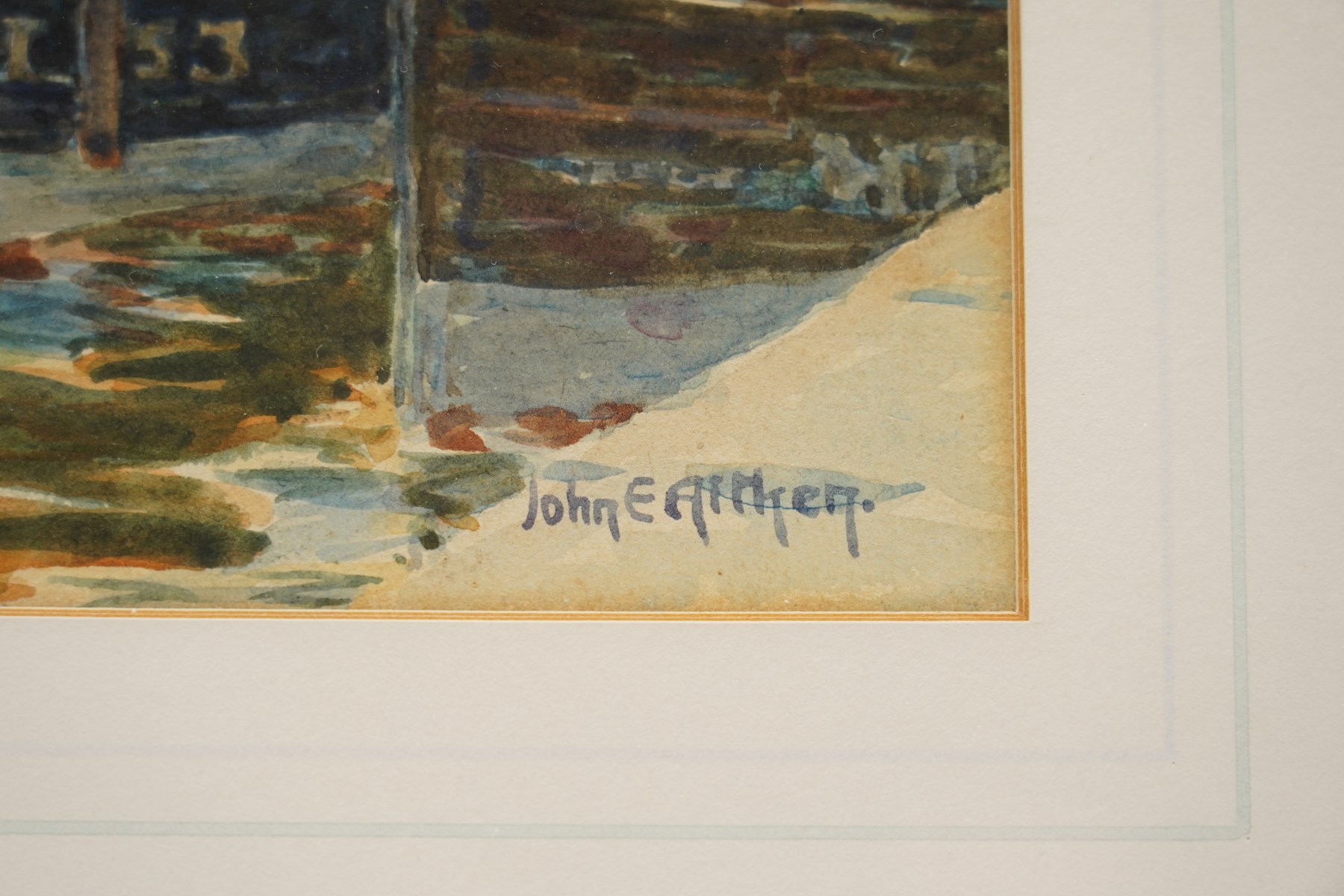 John Ernest Aitken (Scottish 1881-1957): 'An Old Scotch Fishing Town', watercolour signed, titled on label verso 24cm x 17cm; Edwin Earp (British 1851-1945): Fisherman in a Vast Loch, watercolour signed 40.5cm x 61.5cm (2)