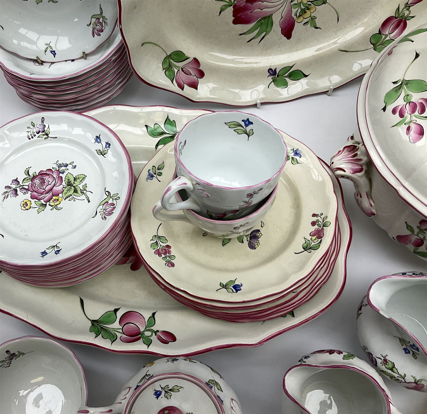 Matched Copeland Spode, Spode and French Luneville and Marlborough Sprays pattern dinner and tea wares, comprising two tureen and covers and apple finials, two sauce tureen and covers with pear finials and fixed stands, six graduated platters including two pairs, large plate, thirteen dinner plates, twelve bowls, ten smaller bowls, eight side plates, eleven smaller side plates, teapot, twin handled sucrier and cover with apple finial, open sucrier, cream jug, smaller cream jug, four breakfast cups, eight tea cups, four large saucers, eleven smaller saucers, and nine further smaller saucers. 