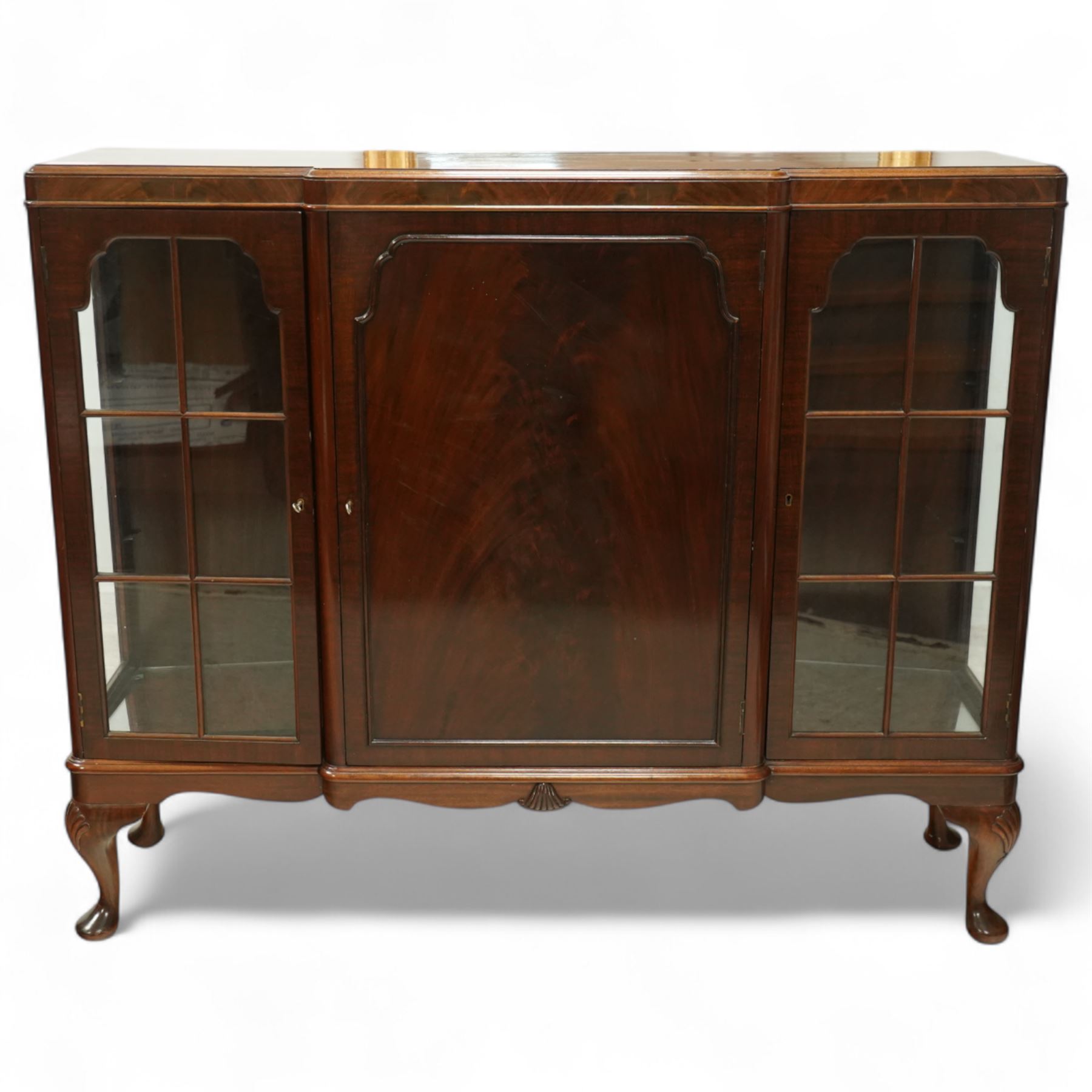 Early 20th-century mahogany glazed side cabinet, rectangular top with moulded edge above central panelled cupboard door enclosing three shelves flanked by two astragal glazed doors enclosing two glass shelves 