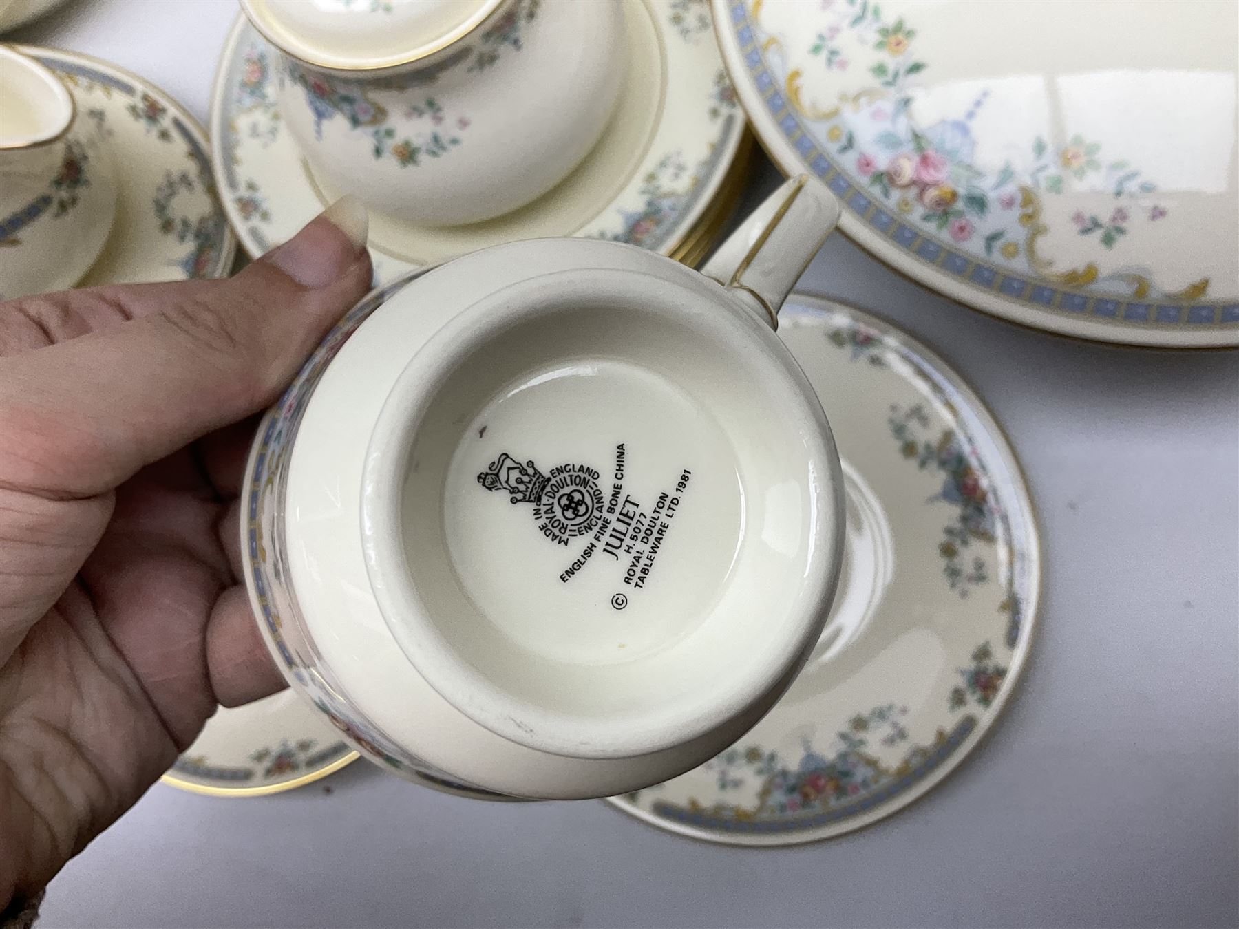 Royal Doulton Romance Collection Juliet pattern tea and dinner service for six, to include dinner plates, lidded tureen, teapot, teapots, saucers, jugs, sauce boat and stand, cake plate, coffee cans and saucers, soup bowls etc, including spares