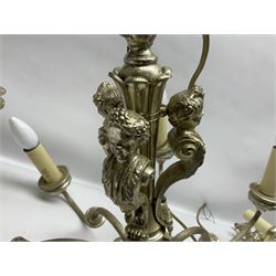 Siz branch silvered chandelier, decorated with acanthus leaves and putti, together with two matching three branch wall sconces, chandelier D65cm