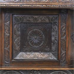 Jacobean revival oak side cabinet, rectangular top above carved frieze of stylised foliage and lunettes, fitted with a central cupboard doors with applied carved panels, above a frieze drawer, supported on turned and carved vase-shaped supports, united by stretcher tier and lower shelf