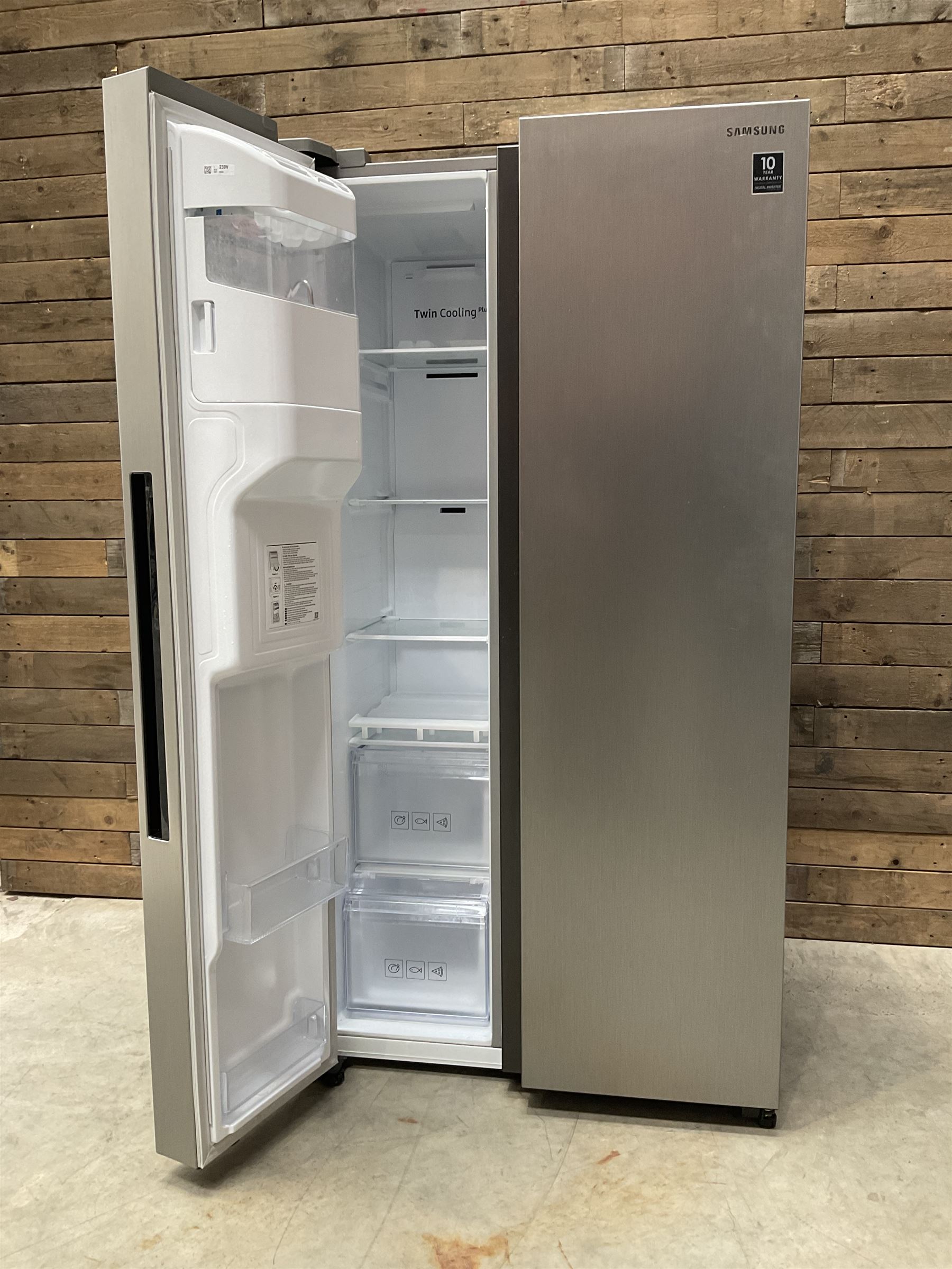 Samsung RS68N8320S9 American style side by side fridge freezer, non plumbed ice and water dispenser. Serial no. 05NT4EBN800405K, August 2020.