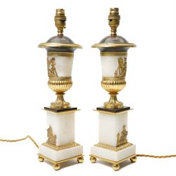 Pair of early 20th-century Neoclassical lamp bases in gilt bronze and alabaster, each decorated with classical figural reliefs celebrating the arts, each of baluster form, the alabaster bodies applied with finely cast gilt-bronze scenes including a seated painter at an easel, a sculptor at work, and allegorical female figures with musical  and theatrical motifs, mounted on square alabaster plinths with gilt-bronze borders and raised on bun feet, the domed shoulders enriched with laurel-leaf mouldings, H42cm 