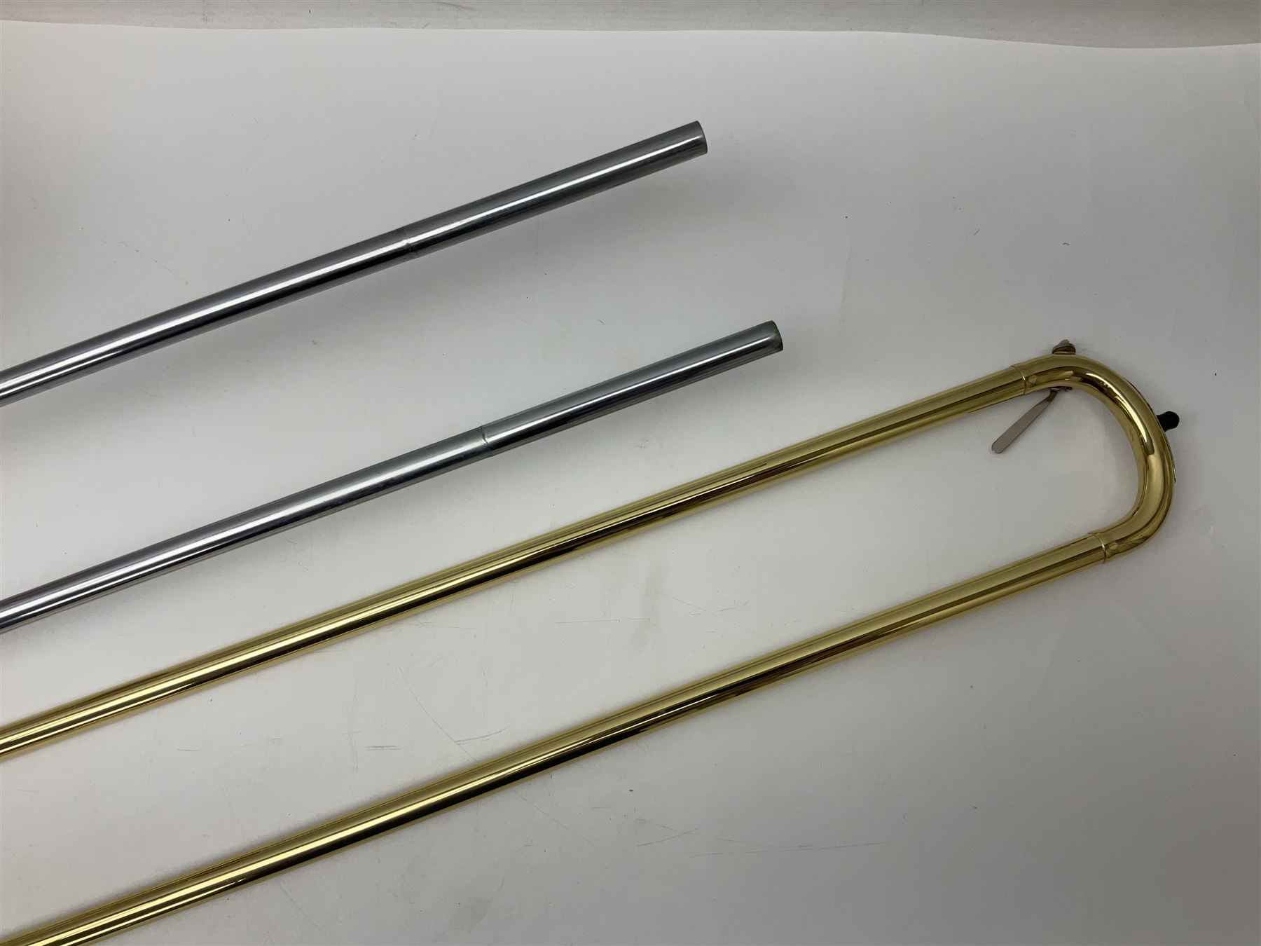 Sebastian Bucklet Aquae Sulis copper and brass trombone No.0910004; in lightweight carrying case; and Kinsman folding tubular chrome music stand in case (2)