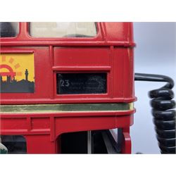 Novelty telephone in the form of a London Routemaster bus, c1997, fitted on wooden plinth with modern connection L25.5cm