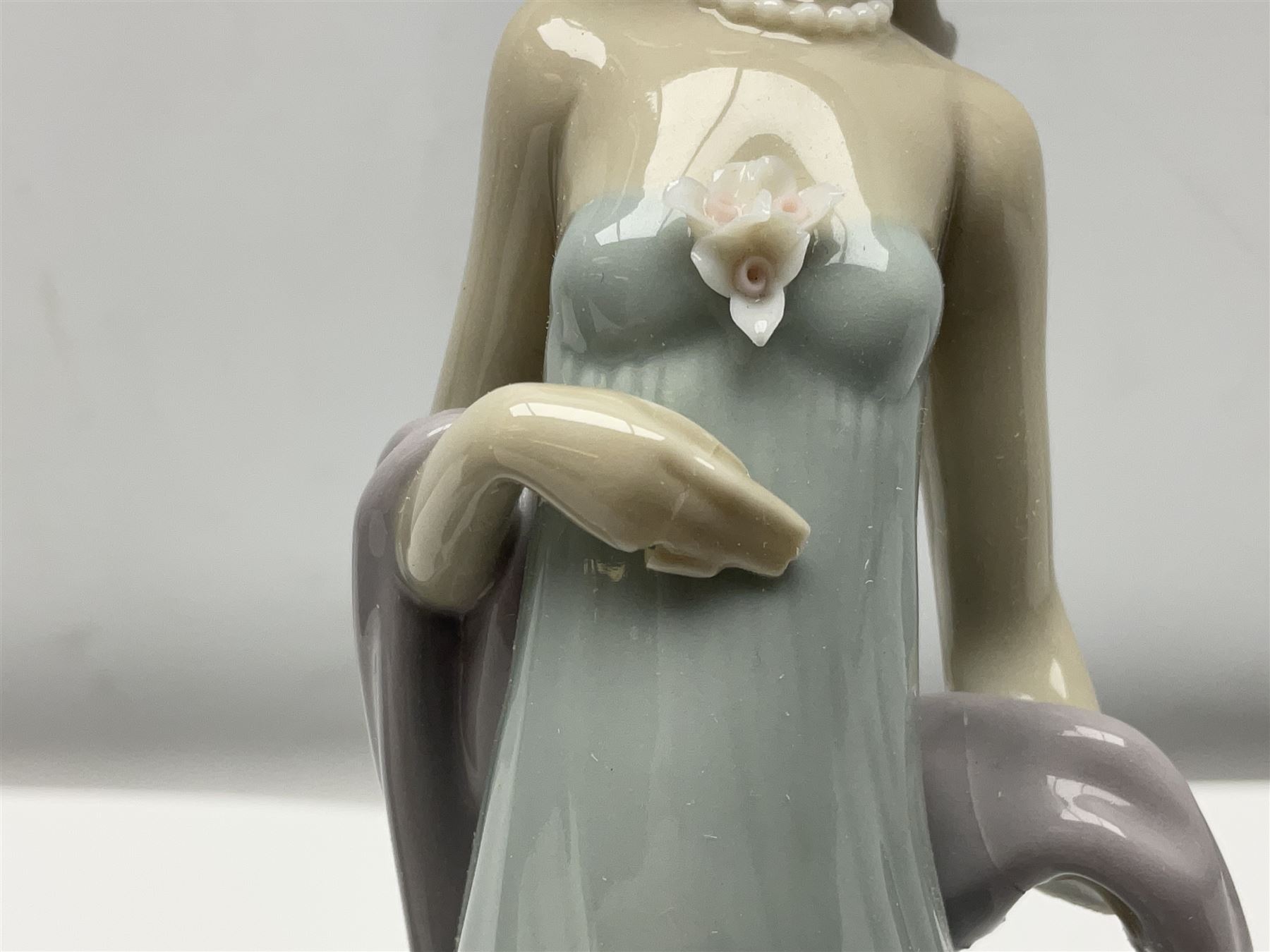 Three Lladro figures of ladies comprising 'The Flirt' model no 5789, 'Ingenue' model no 5487 and 'Carefree' model no 5790, all with boxes