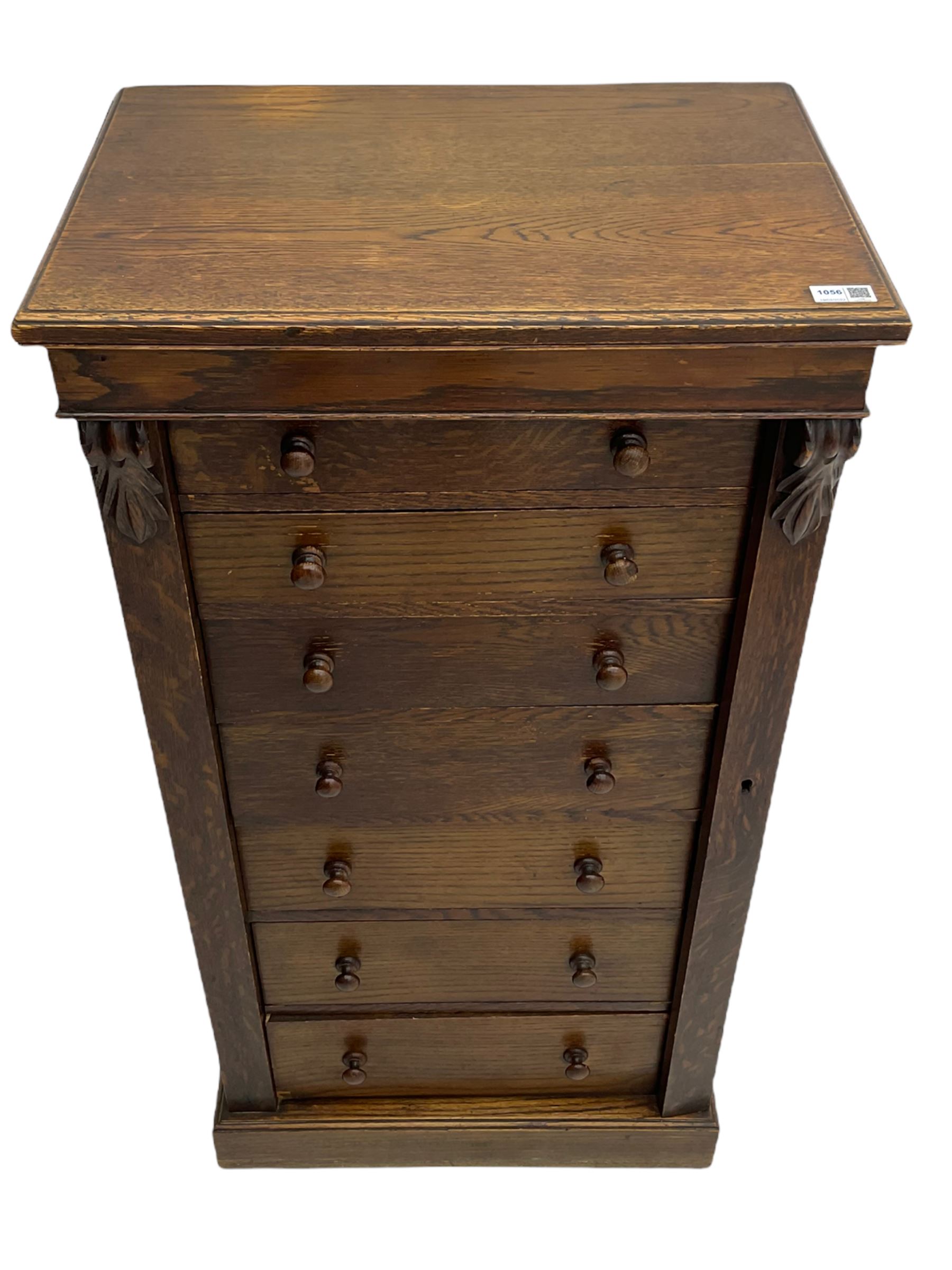 Victorian oak Wellington chest, fitted with seven drawers, lockable hinged side return