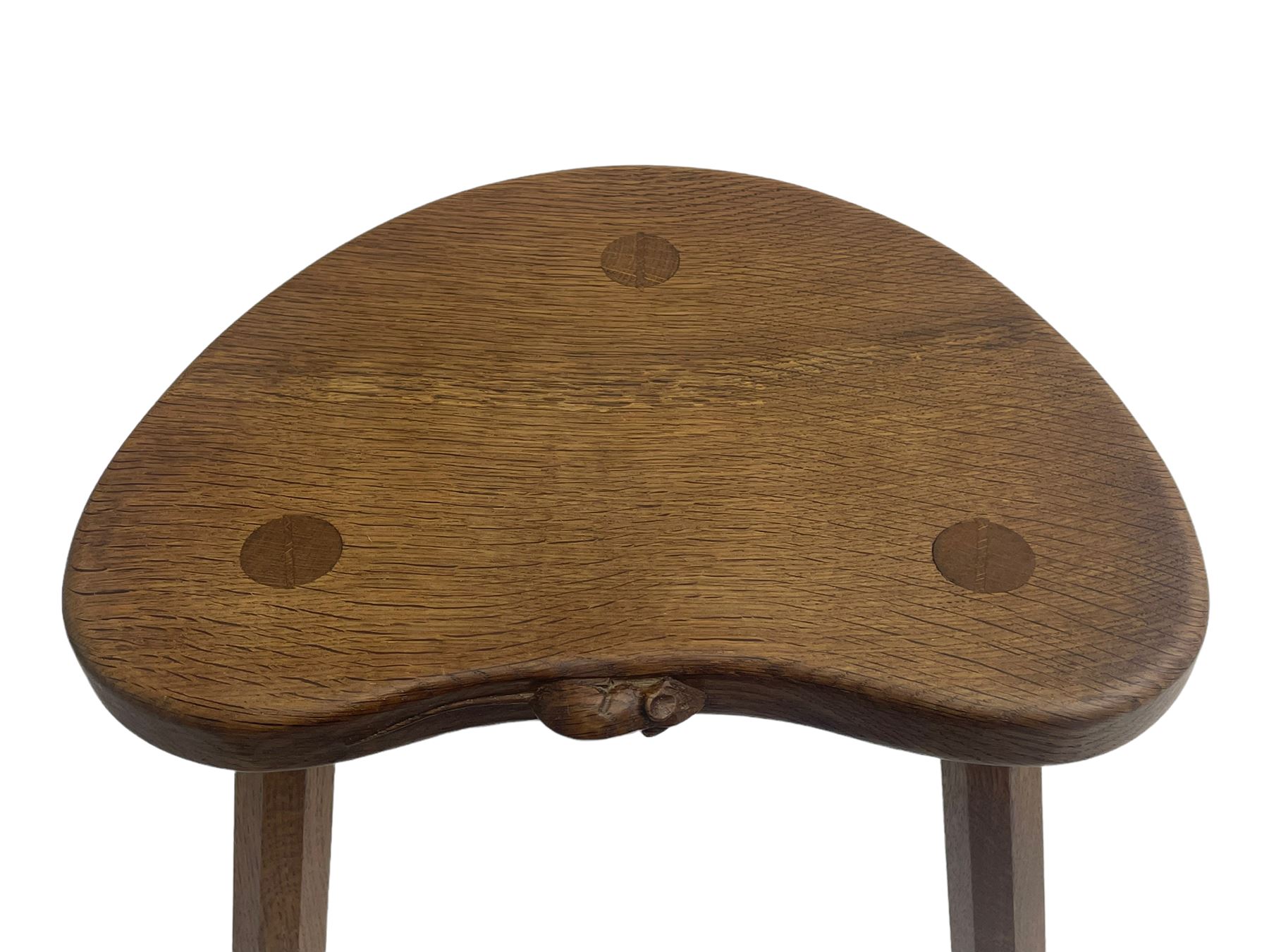 'Mouseman' oak three-legged stool, kidney shaped dished seat carved with mouse signature to edge, by Robert Thomas of Kilburn