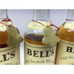 Four bottles of Bells extra special blended whisky, together with two bottled of Grants blended whisky, various contents and proof (6)