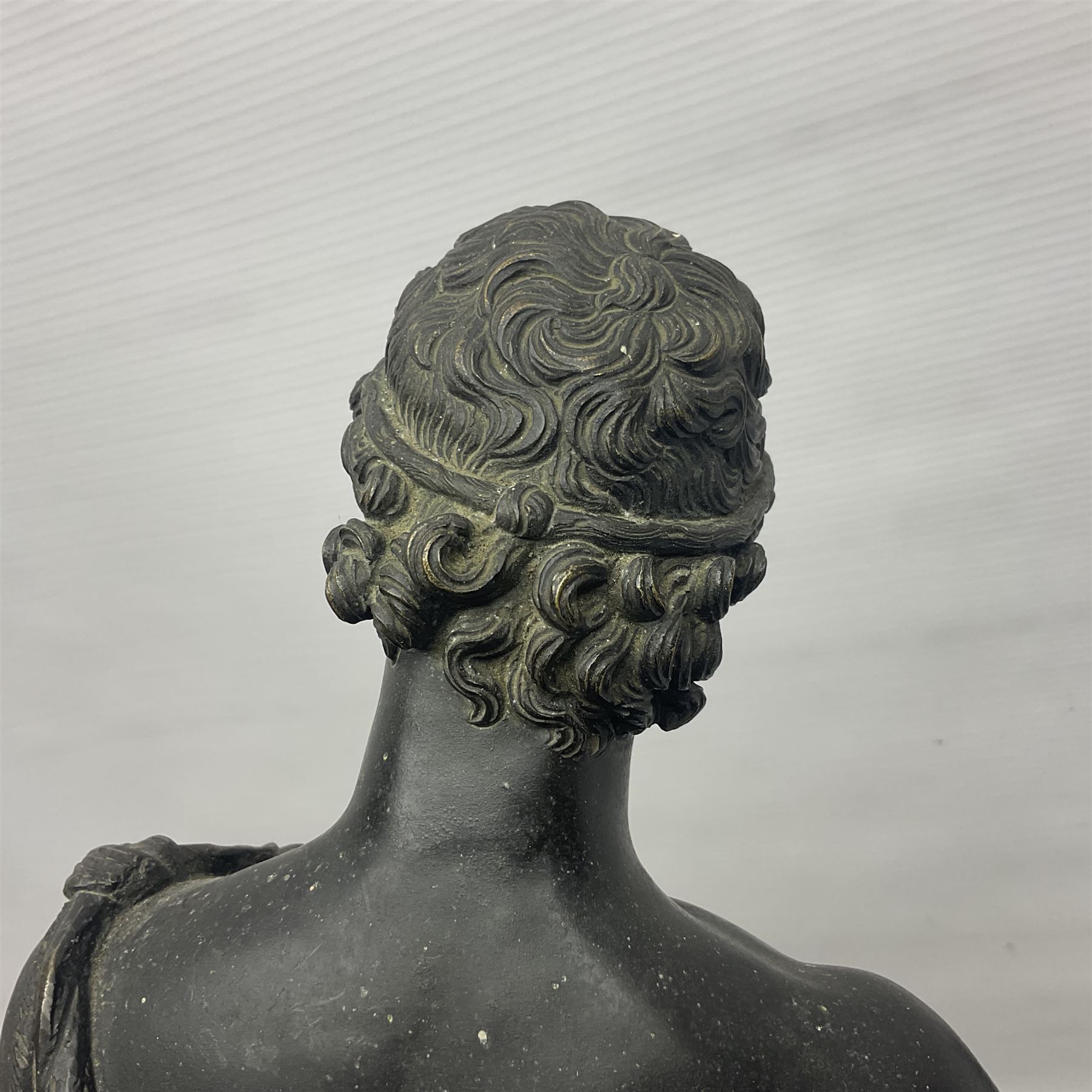 Bronzed classical nude male figure, upon a stepped circular base, H61cm 