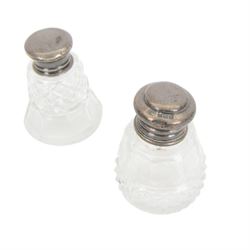 Collection of silver topped cut glass dressing table jars, together with a silver plated perfume bottle and large cut glass jar and cover