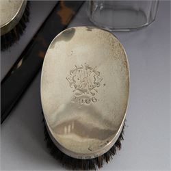 Edwardian tortoiseshell page turner with silver handle, hallmarked Birmingham 1906, maker's mark worn and indistinct, together with a pair of Edwardian silver mounted horsehair brushes engraved with monogram, and two faceted glass jars with silver lids and applied initial N to covers, all hallmarked 