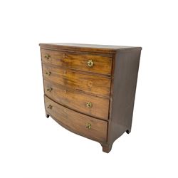 Regency mahogany bow front chest, the top with ebony and satinwood stringing, fitted with four cockbeaded drawers with brass pull handles and bone escutcheons, on bracket feet
