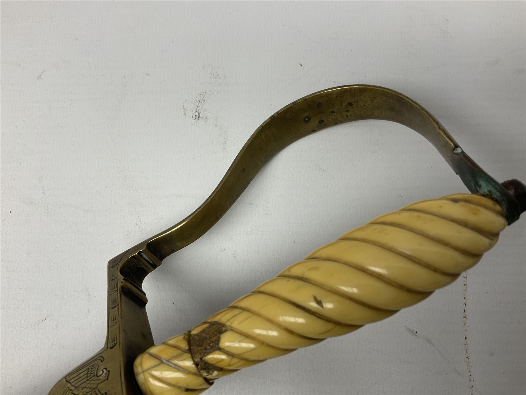 1900-1918 German Imperial NCO sabre with WW2 modifications of Wehrmacht insignia to the langet, 79cm slightly curving fullered blade and brass hilt, the knucklebow chased with oak leaves and acorns L90.5cm overall
This item has been registered for sale under Section 10 of the APHA Ivory Act 