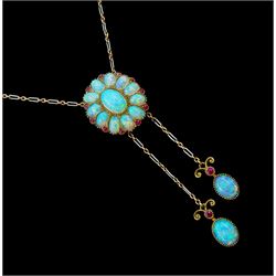 Edwardian gold opal and ruby pendant necklace, the central milgrain set cluster, suspending to two further opal and ruby drops, on platinum and gold trace link chain, with opal clasp
