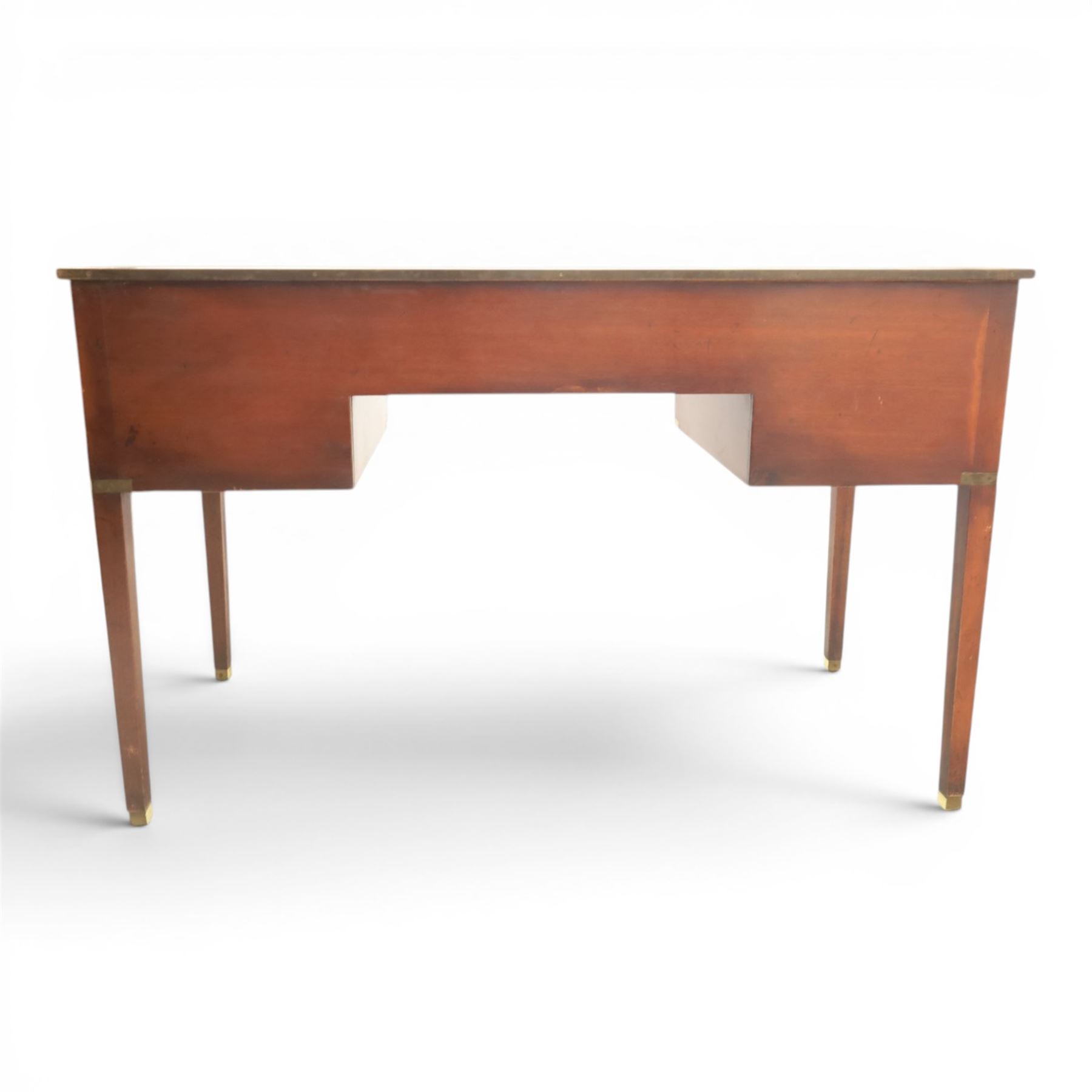 Military campaign style mahogany writing desk, inset gilt-tooled green leather writing surface, fitted with five drawers with recessed brass handles, brass corner mounts and protective bindings, on square tapering legs