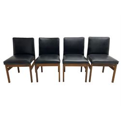 Set four teak chairs upholstered in black faux leather, raised on square supports 