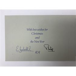 H.M. Queen Elizabeth II and HRH The Duke of Edinburgh, signed 1979 Christmas card with twin gilt ciphers to cover, colour photographic print of the Royal family standing in a garden, signed ‘Elizabeth R and Philip’ with manuscript date 1979 below