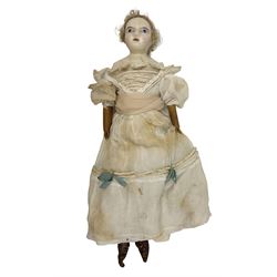 Victorian wax shoulder head doll with pale complexion, applied hair, inset glass eyes and fabric covered jointed body with kid leather lower arms; white linen dress and undergarments H50cm