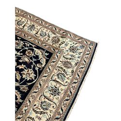 Central Persian part silk indigo ground Nain carpet, the field decorated with interlacing leafy branches and stylised plant motifs, scrolling design border within guard stripes 