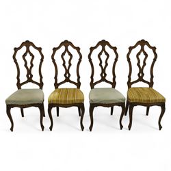 20th-century set of four French provincial-style stained beech dining chairs, pierced cart...