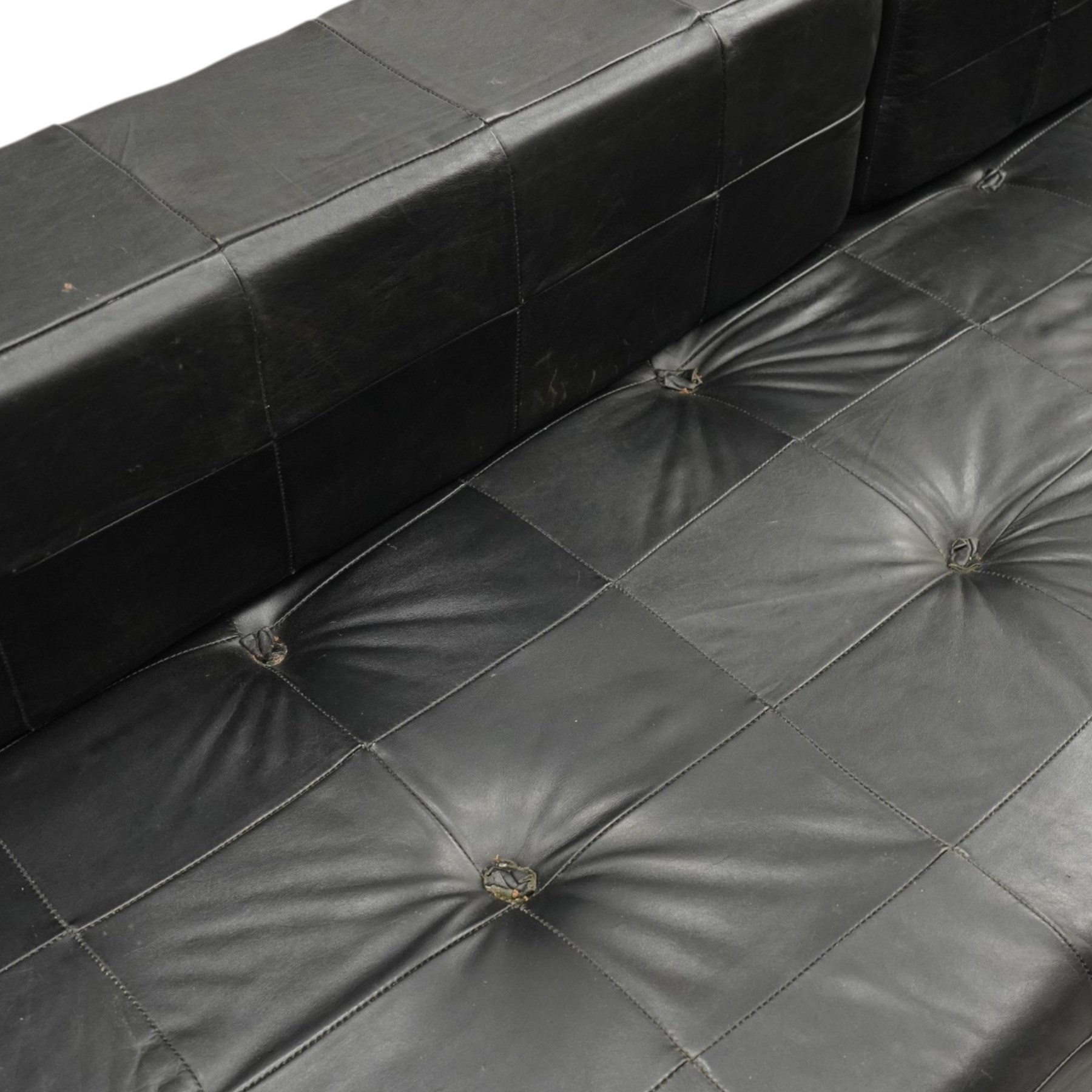 De Sede - 1970s 'DS 80' black leather modular settee or daybed, low upholstered bacl with loose rectangular back cushions over padded seat, raised on tubular chrome supports