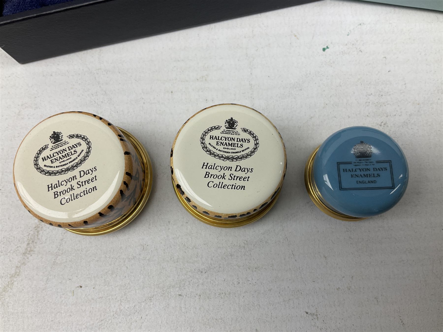 Group of seven Halcyon Days enamel boxes, each with affectionate inscriptions, including 'Wild about you', 'Don't ever change', 'Love you a bunch', etc., in six fitted boxes  