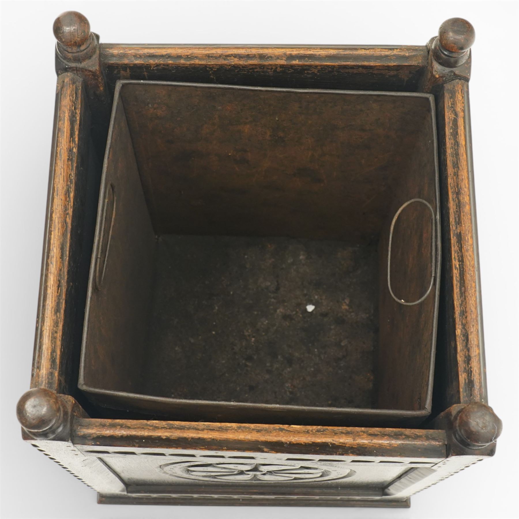 20th century carved fireside accessories; a carved coal bucket with metal liner and a carved fire screen