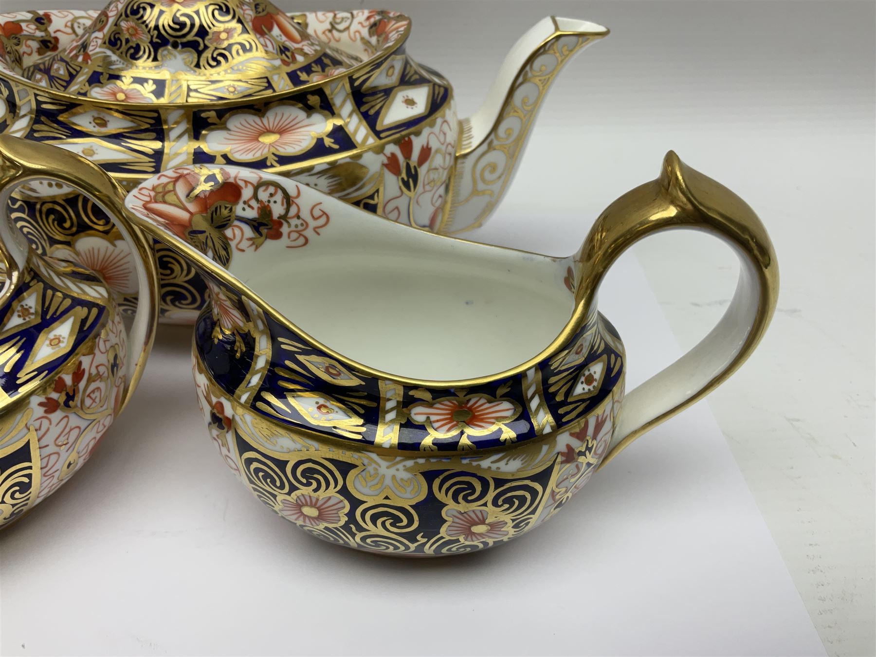 Royal Crown Derby 2451 Imari pattern three piece tea set, comprising teapot, covered sucrier and milk jug, teapot H12cm 