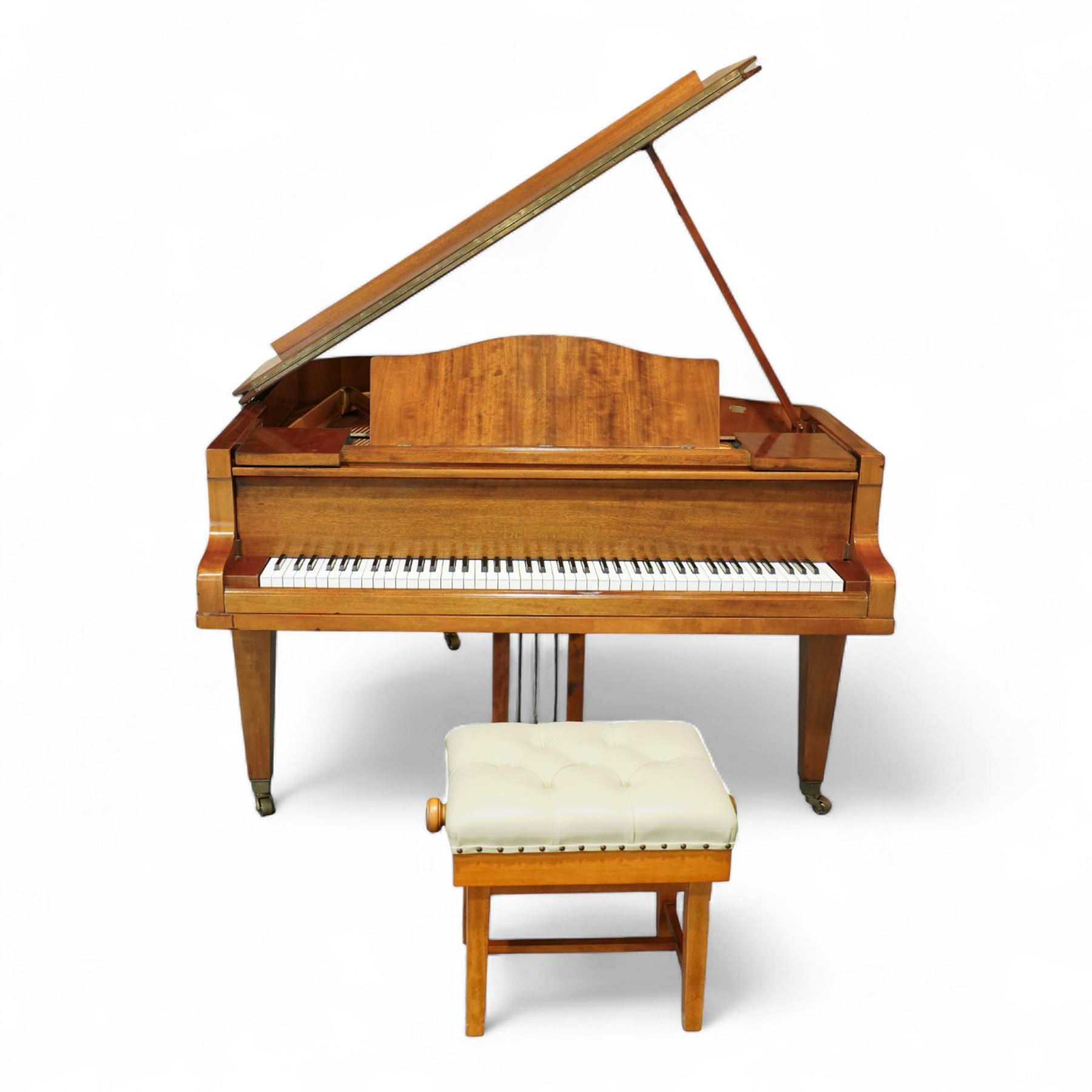 Julius Bluthner-light mahogany overstrung Baby Grand Piano serial No 118183 (1934), with a grand roller action, 88 ivory and ebony keys AO-C7, raised on three square tapered legs with brass castors, adjustable music desk and Lyre with sustain and una-corda pedals, recently (2007) thoroughly restored, case re-finished and polished, action completely overhauled and adjusted with good repetition, frame totally re-strung including copper wound bass strings, new tuning pins, hammer heads, dampers and traditional blue Bluthner string felt, in very good playing condition. With a matching adjustable piano stool fitted with a leather cover. Tuned to concert pitch, A=440.  Complete with key fall lock and key and three castor cups.
This item has been registered for sale under section 10 of the APHA Ivory Act, Reference X76CPCS8