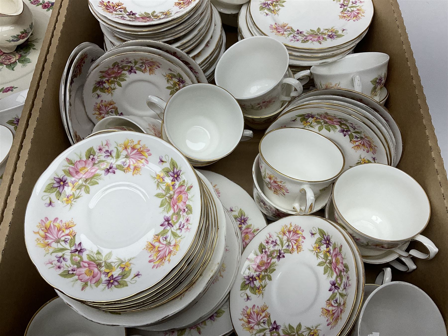 Royal Staffordshire Dinnerware by Clarice Cliff Nancy pattern dinner wares, including sauce boat, dinner plates, side plate and serving platter, together with a collection of Colclough Wayside Honeysuckle pattern tea wares