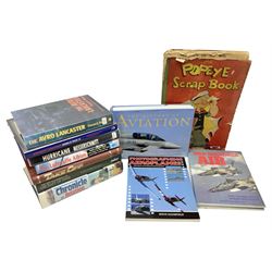 Ten books of predominantly military aircraft interest including Aircraft Anatomy World War Two, Hurricane Messerschmitt, The Avro Lancaster, The Luftwaffe Album, Encyclopaedia of Aircraft of WWII etc; together with a scrap album of WW2 newspaper cuttings
