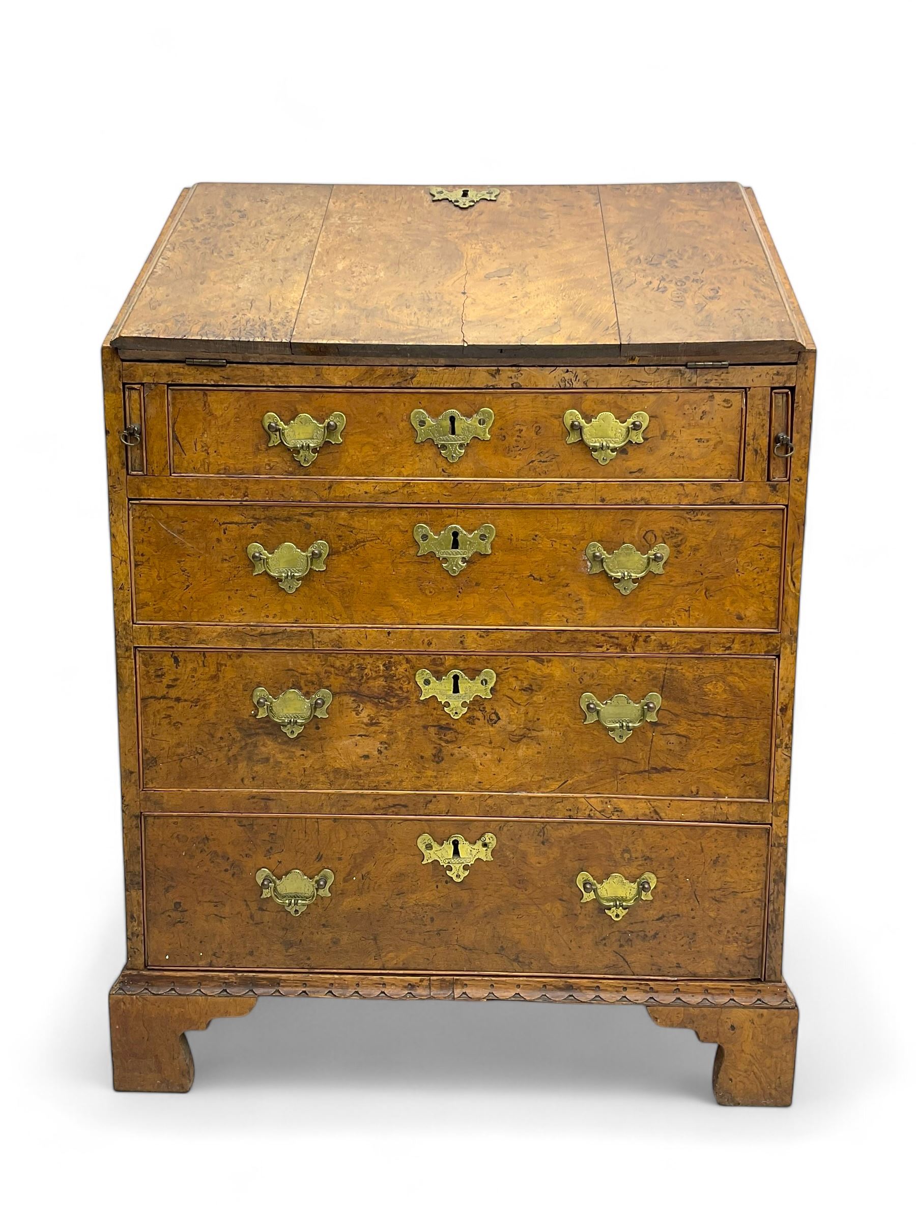 George III figured walnut bureau, fall-front enclosing central cupboard, six pigeonholes and six drawers, fitted with four graduated cockbeaded drawers, on bracket feet