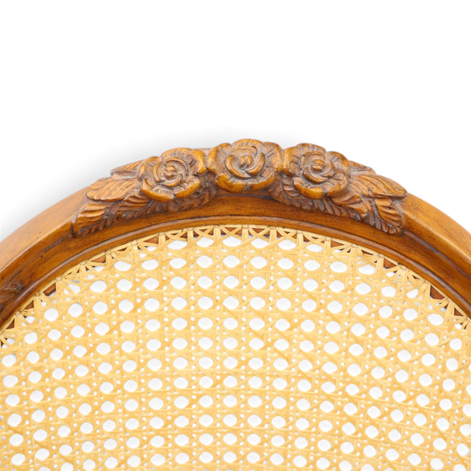 And So To Bed - French design 'Floral Caned Chair', balloon caned back with foliate carving, above a caned serpentine seat, reeded and turned supports