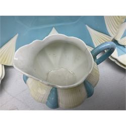 Shelley Dainty pattern tea wares, of lobed form with blue star decoration on merging white and yellow ground, comprising five teacups, five saucers, six tea plates, milk jug and cake plate, all with printed green mark beneath, some with painted pattern no 11770