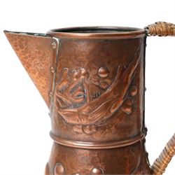 Newlyn Arts and Crafts beaten copper jug, the planished exterior decorated with fish, stamped Newlyn to base, H27cm 