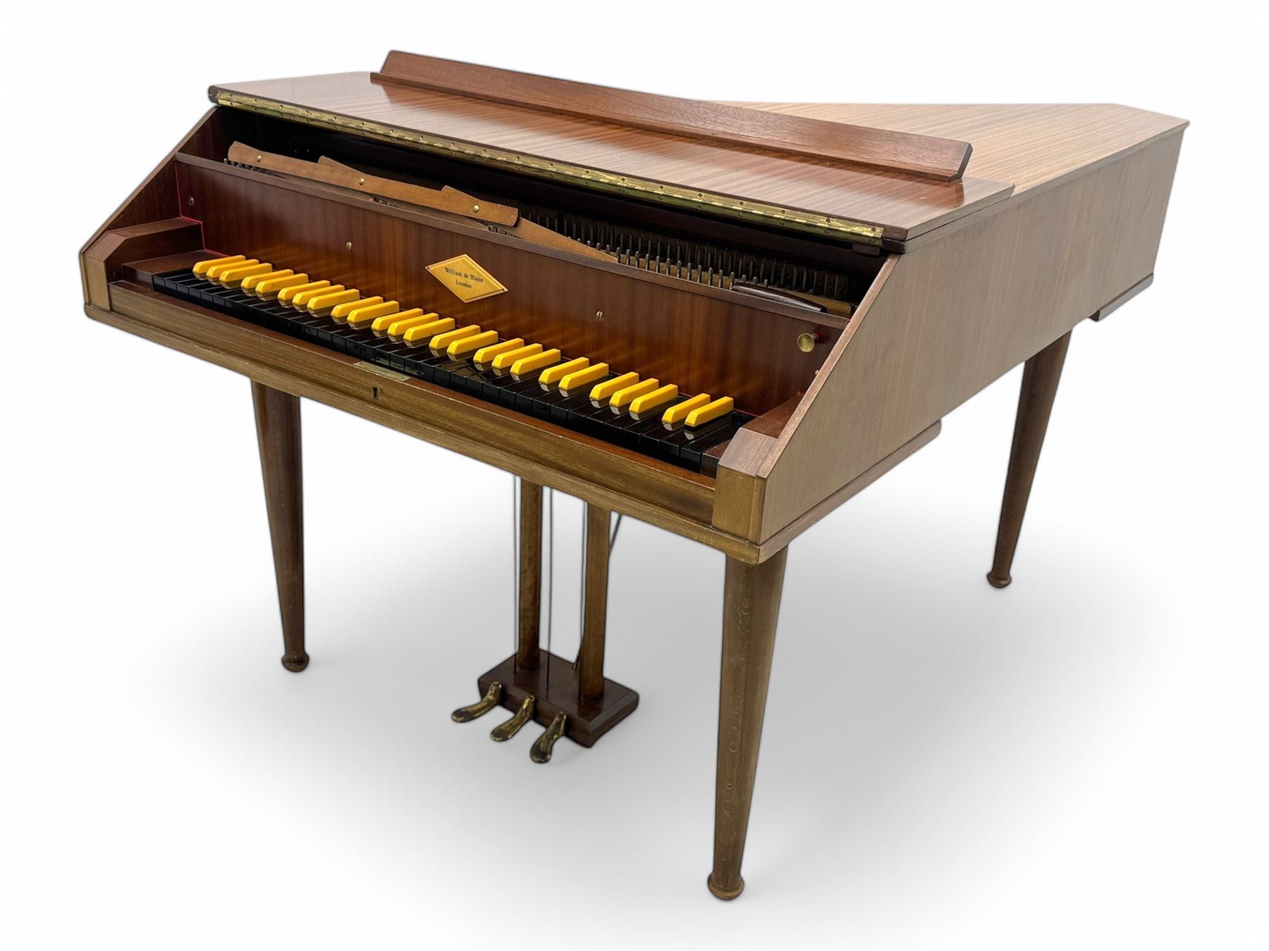 William de Blaise of London- mid 20th century Cembalo Traverso one manual Harpsichord in a teak case, with a five octave F1-f3 compass, two sets of strings and two rows of jacks, with three pedals and one hand stop, with one 8' and one 4', harp and piano to to 8', with a folding music desk and key fall, tuning key and tuning fork.
