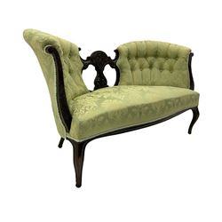 Late Victorian mahogany framed two seat settee, double fan shaped buttoned back with pierced central splat relief carved with scrolls and foliate, upholstered in pale green foliate pattern fabric, cabriole supports