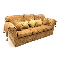 Grande three seat sofa upholstered in red and gold damask fabric with complimentary cushions