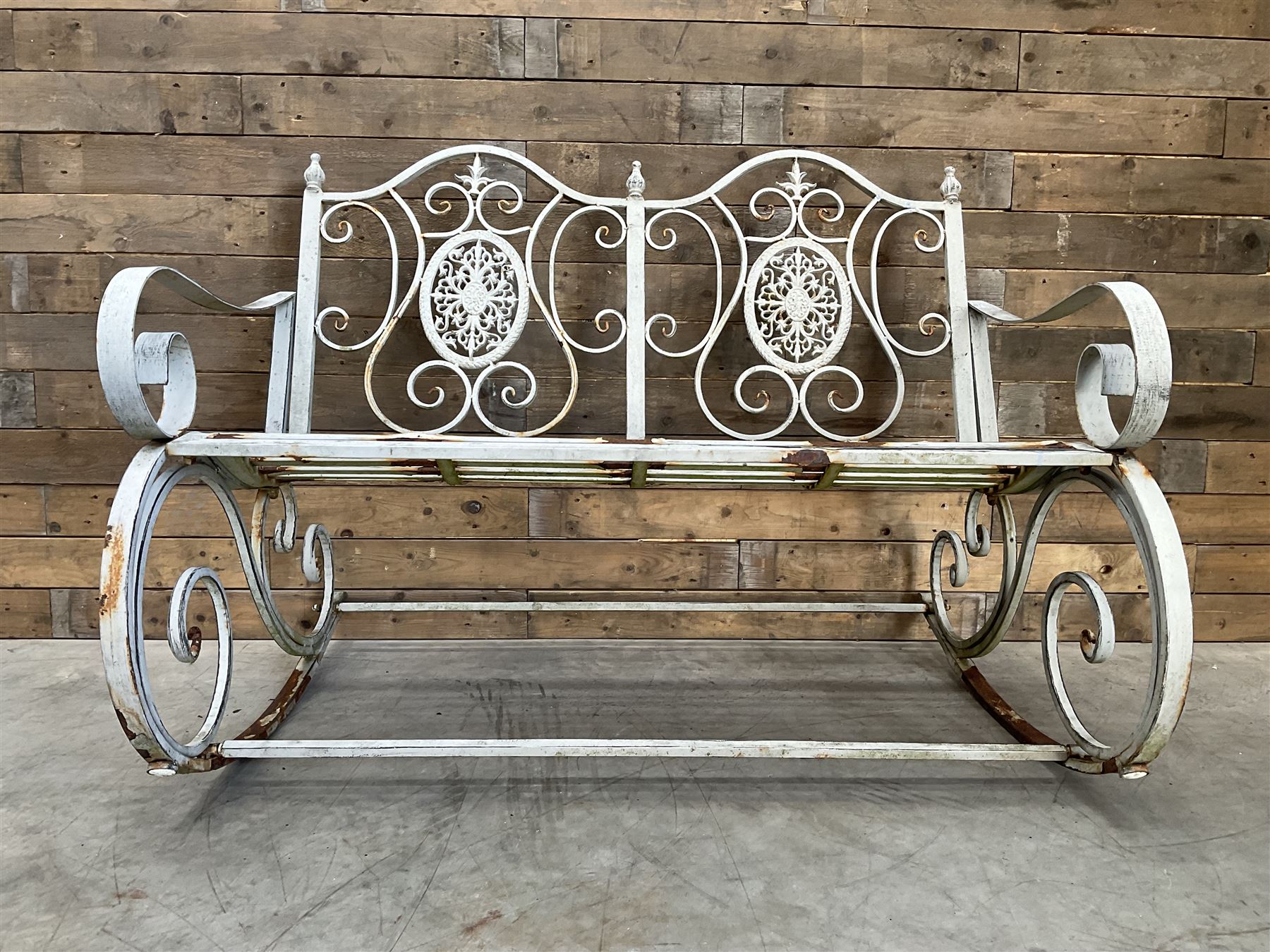 Wrought metal rocking garden bench seat, in antique grey finish