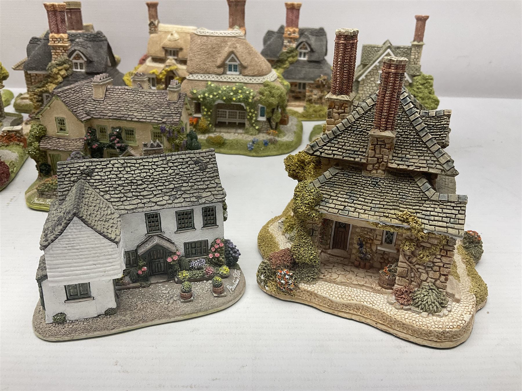 Eight Lilliput Lane limited edition Beatrix Potter models, including Buckle Yeat, Tabitha Twitchits Shop and Ginger Pickles Shop, together with twelve Lilliput Lane models from the Blaise Hamlet collection, including Dial Cottage, Diamond Cottage and Vine Cottage, all with deeds and original boxes (20)