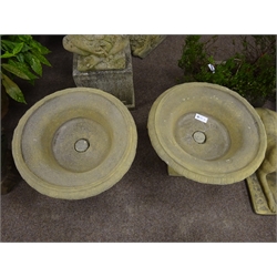  Pair composite stone urn planters, circular form with egg and dart rim and gadroon underside, on tapered pedestal bases, D62cm  
