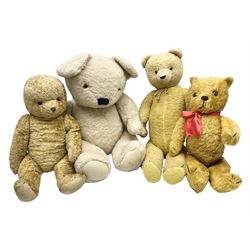 Four mid-20th century and later teddy bears including American style long bodied H71cm; large plush covered with traces of label, possibly Merrythought H75cm; and two others (4)