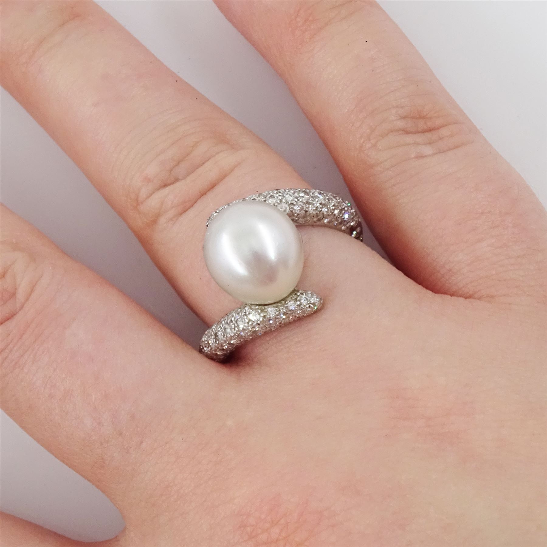 Chanel 18ct white gold pearl and diamond crossover ring, single cultured white / grey pearl, with pave set round brilliant cut diamond shoulders, hallmarked