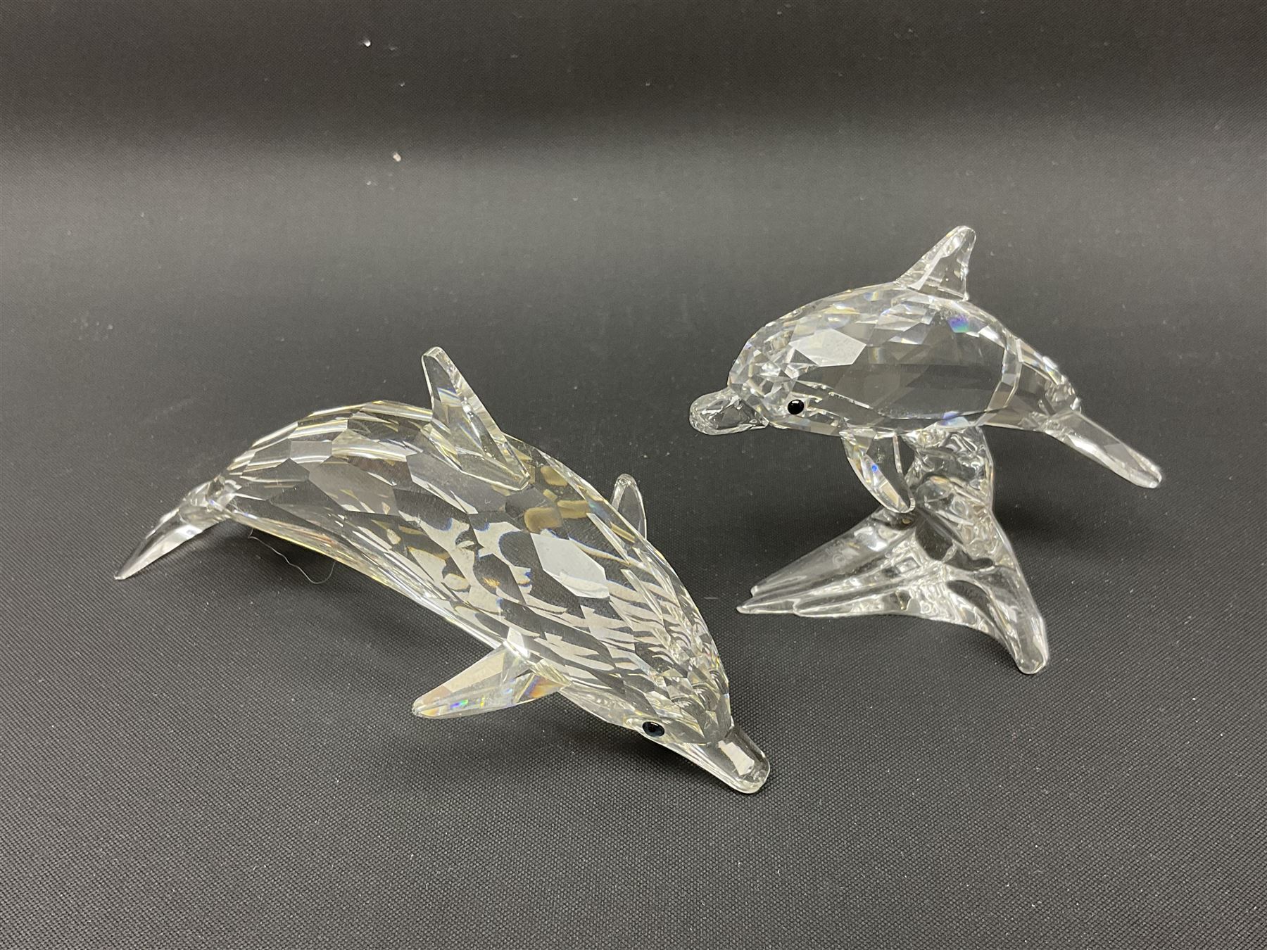 Nineteen Swarovski Crystal sea creatures, to include dolphins, seals, puffer fish, octopus, crabs, together with a quantity Swarovski Crystal shells 