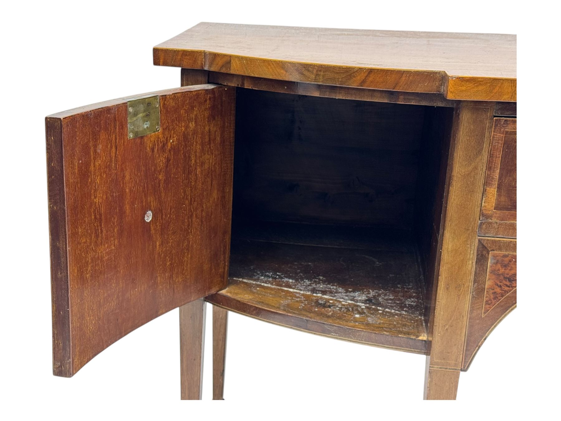 George III mahogany bow-fronted sideboard, serpentine-shaped top with crossbanded and boxwood stringing, over a central drawer flanked by deep cupboards, on square tapering supports terminating in spade feet